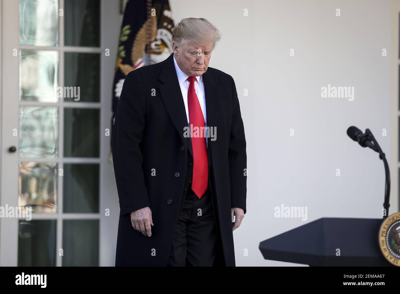 President Donald Trump walks out of the Oval Office to announce a deal ...
