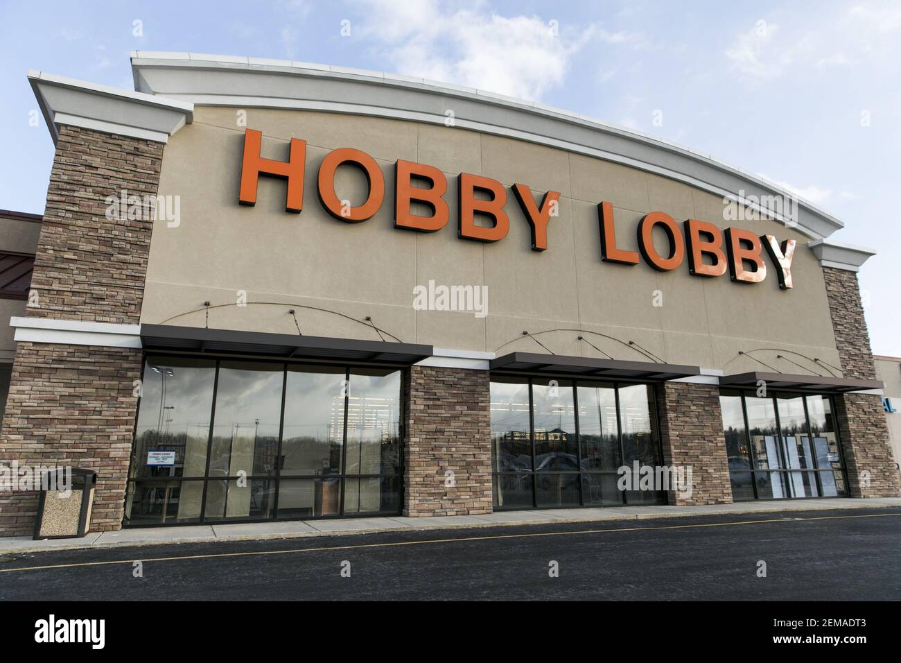 A logo sign outside of a Hobby Lobby retail store location in