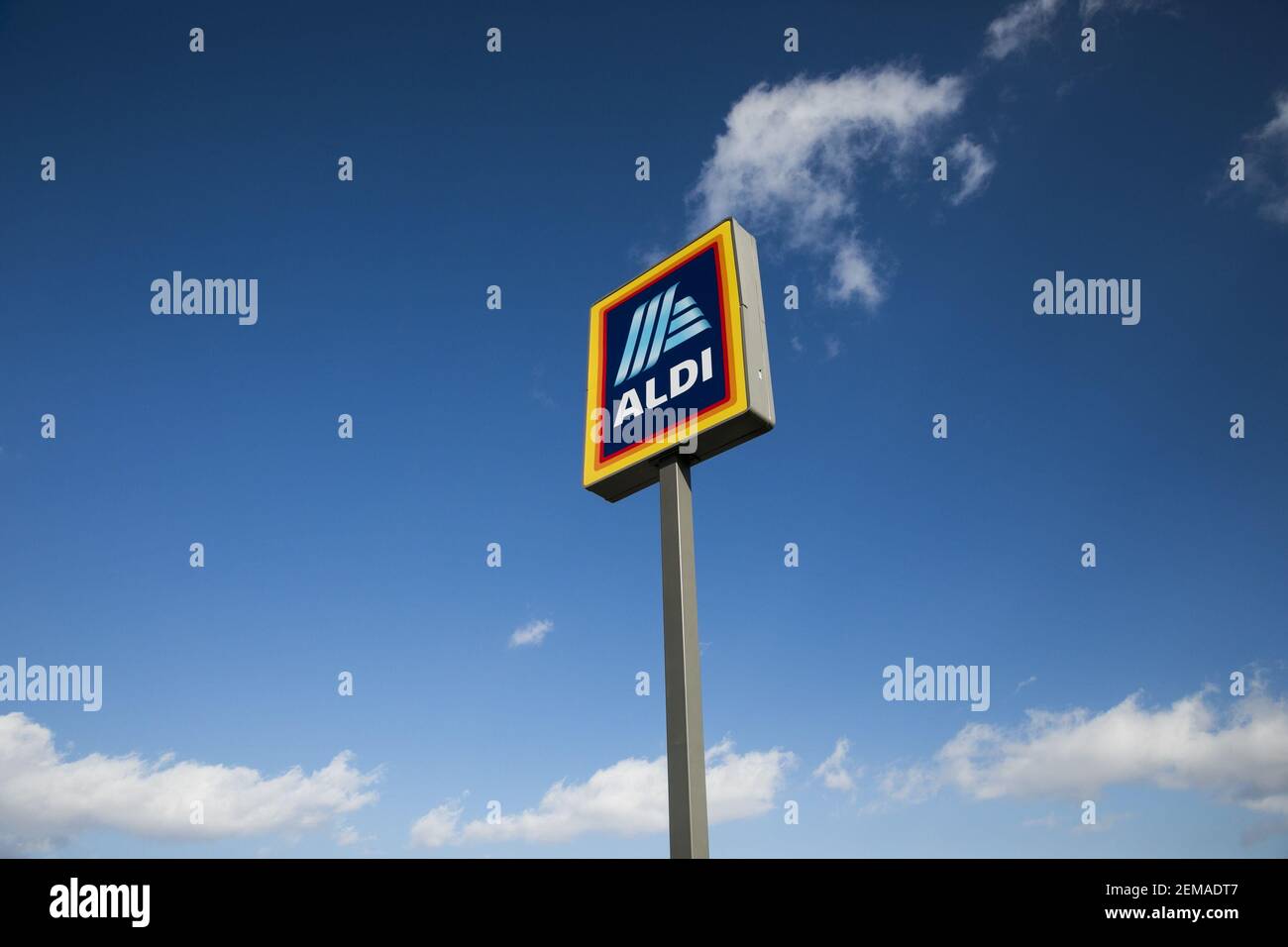 A logo sign outside of a Aldi retail grocery store location in