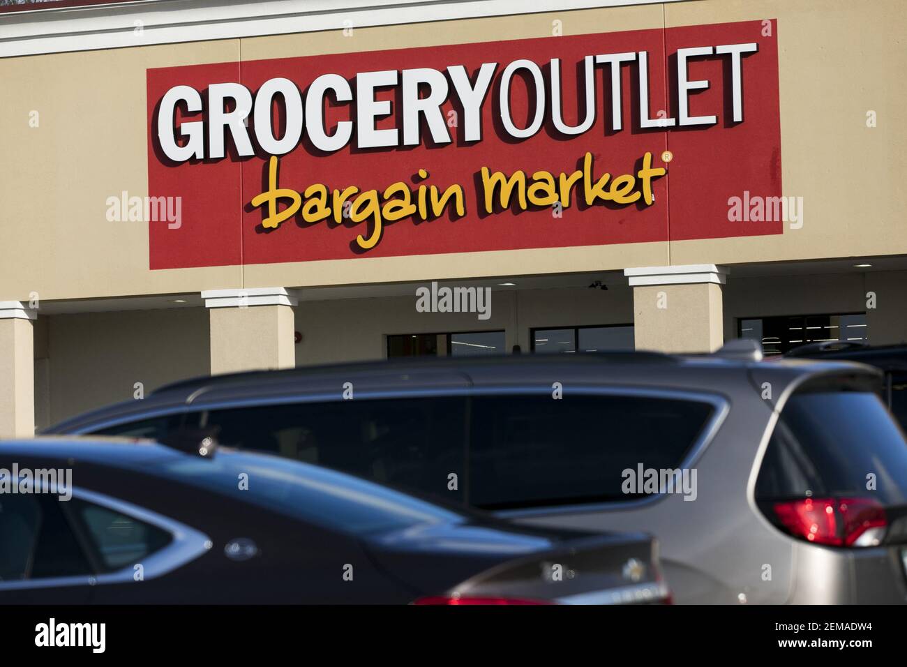 A logo sign outside of a Grocery Outlet retail grocery store location
