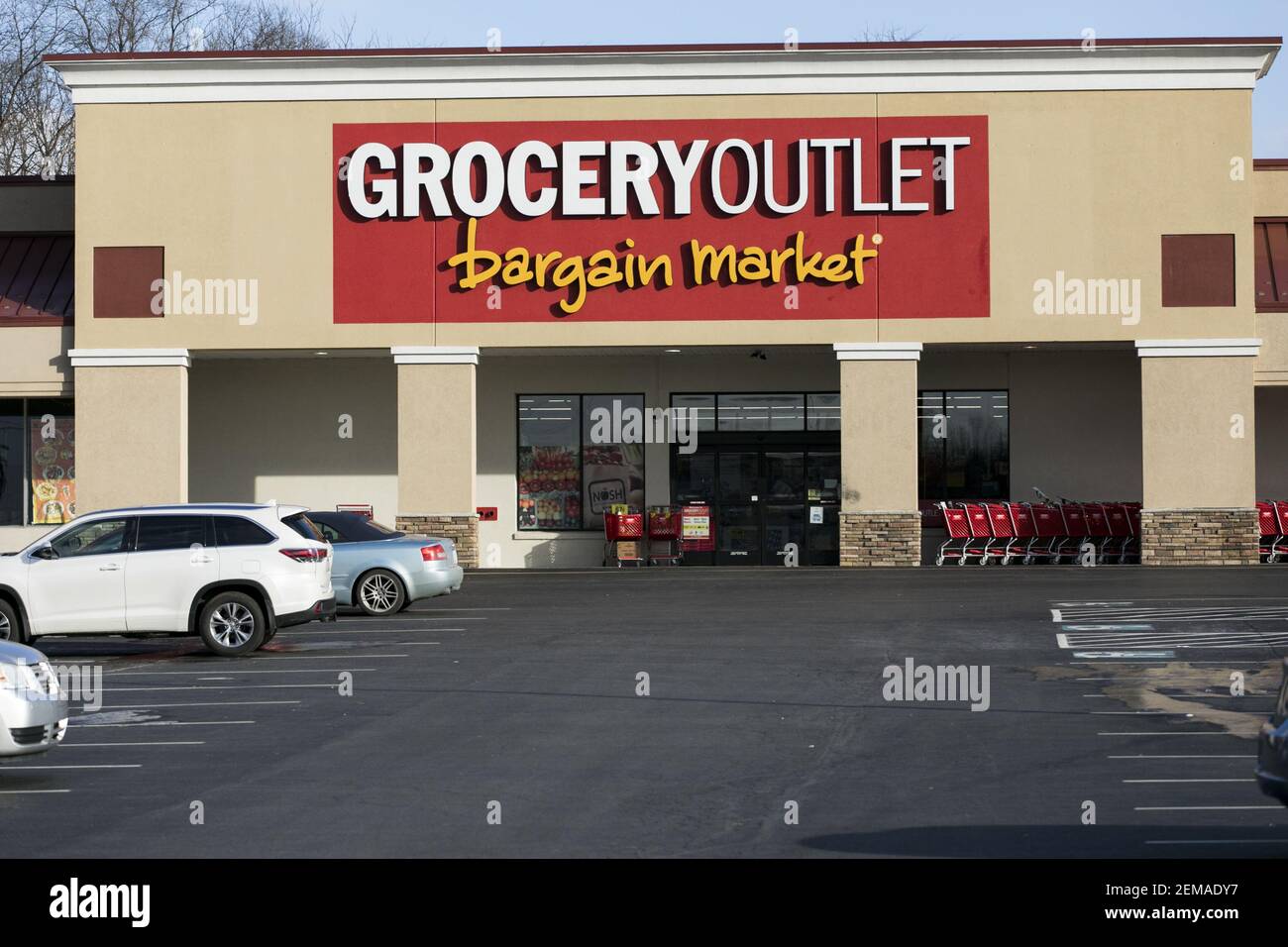 A logo sign outside of a Grocery Outlet retail grocery store location