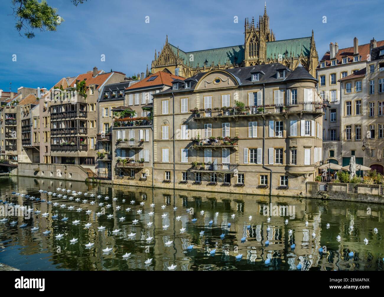 art installation of hundreds of origami boats on the Moselle river in Metz during the Constellation de Metz festival, Metz, Lorraine, Moselle departme Stock Photo