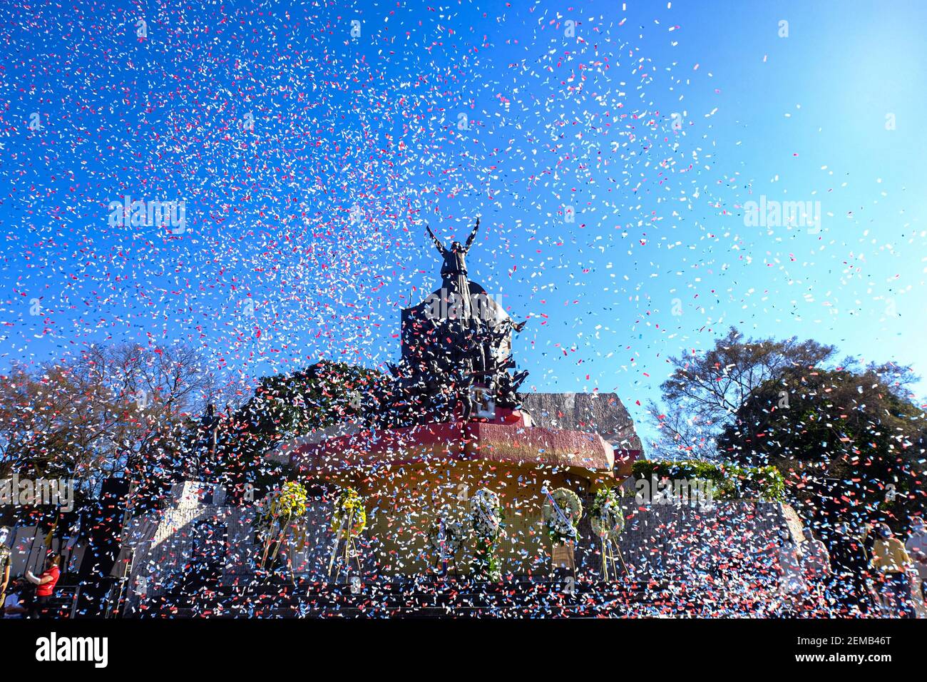 Manila, Philippines. 25th Feb, 2021. A confetti showers the facade of the People Power Monument as part of commemorating the 35th anniversary of EDSA Revolution in front of the People Power Monument. This year's theme is 'EDSA 2021: Kapayapaan, Paghilom, Pagbangon (Peace, Healing, Recovery), to reflect on the national efforts in the face of COVID-19 pandemic. Manila, Philippines. Credit: Majority World CIC/Alamy Live News Stock Photo