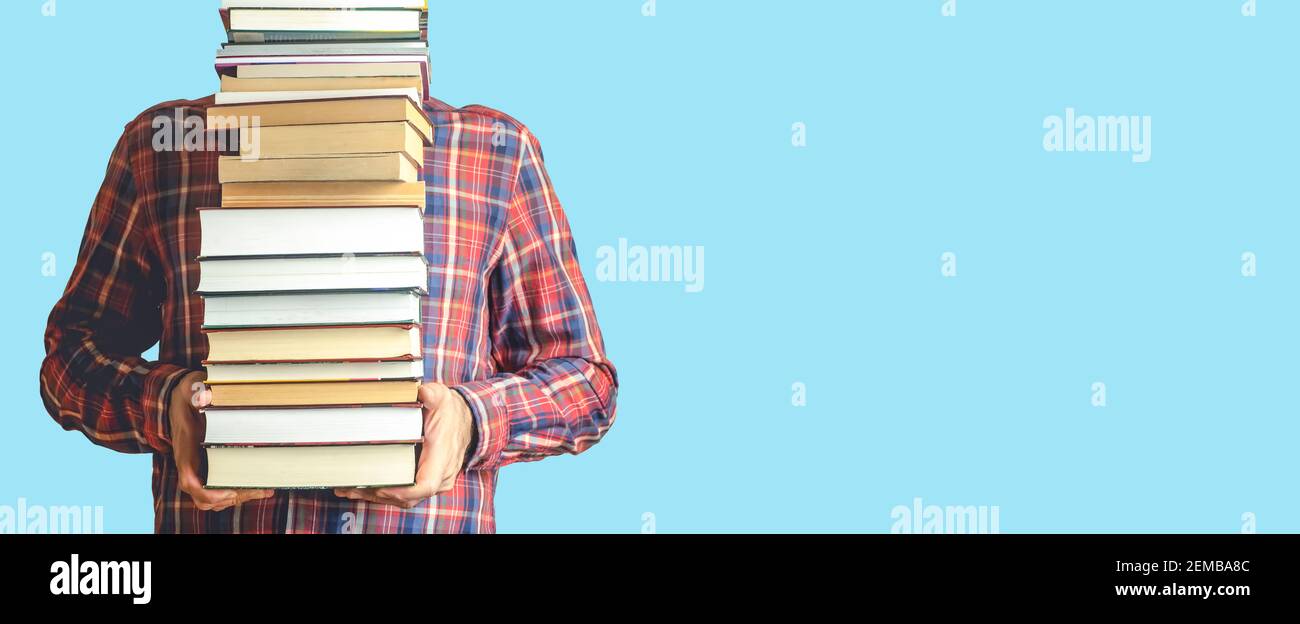 Student with books on a blank colored banner background. Education, reading  and study background concept Stock Photo - Alamy