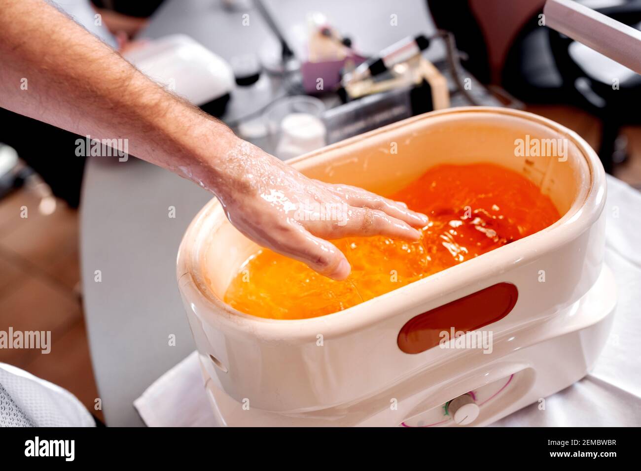 Manicure treatment with applying paraffin wax, nail salon, extra soft