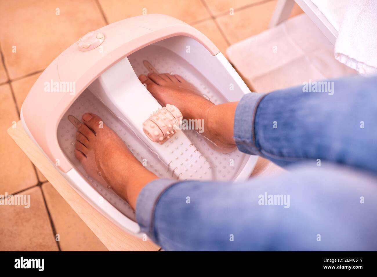 Foot spa pedicure, feet soaked in foot bath tub, healthy feet concept