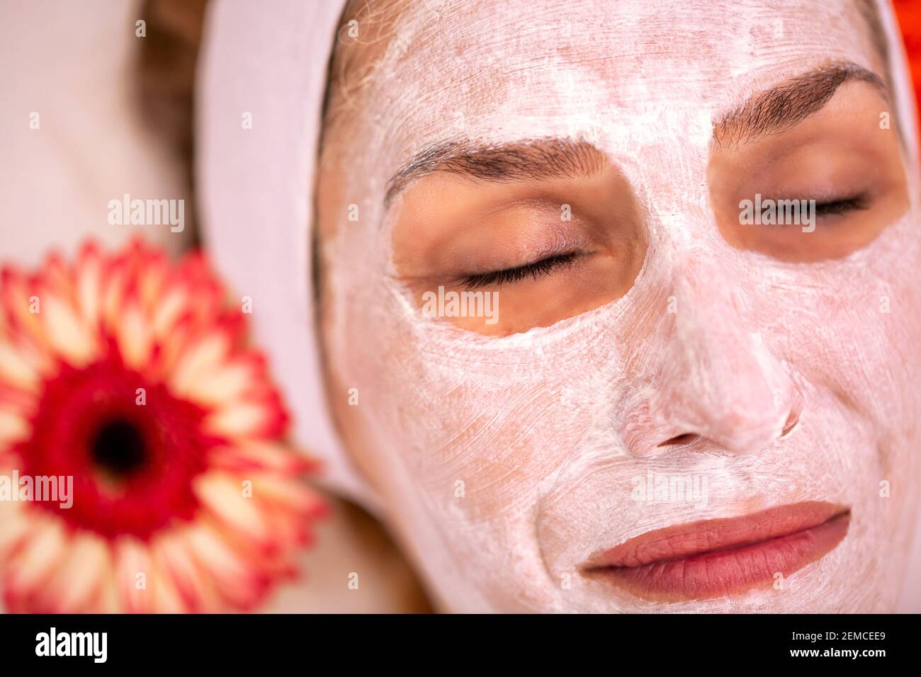 Close up of a woman wearing a cosmetic face mask to draw out the