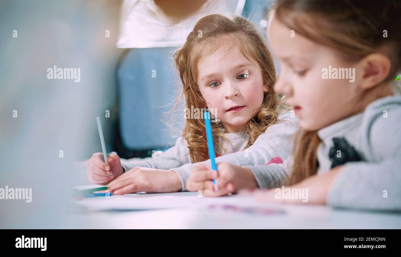 little girl watches the fact that he wrote her friend Stock Photo