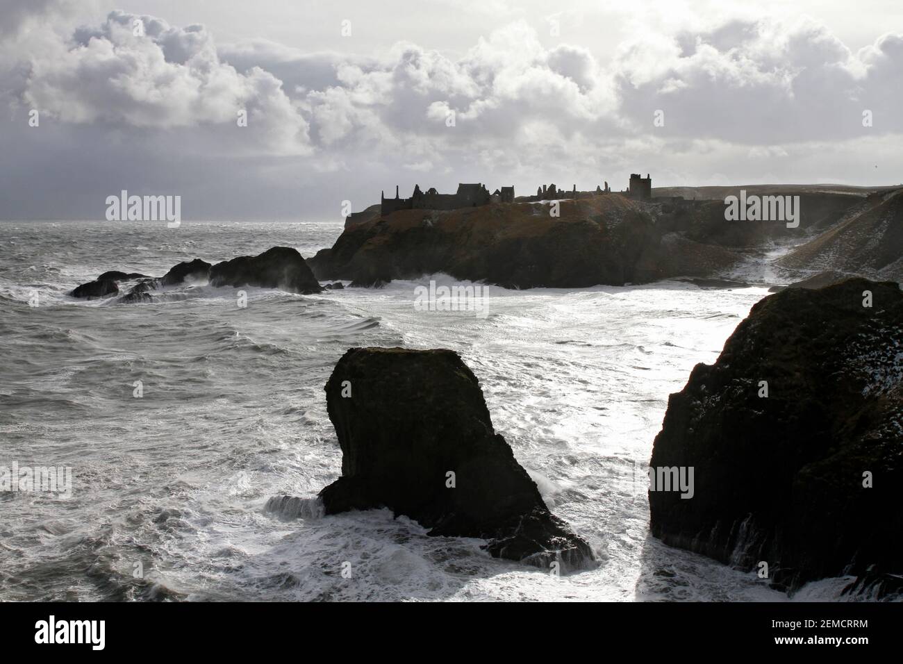 Dunnottar Castle in stormy weather, from across Castle Haven, near