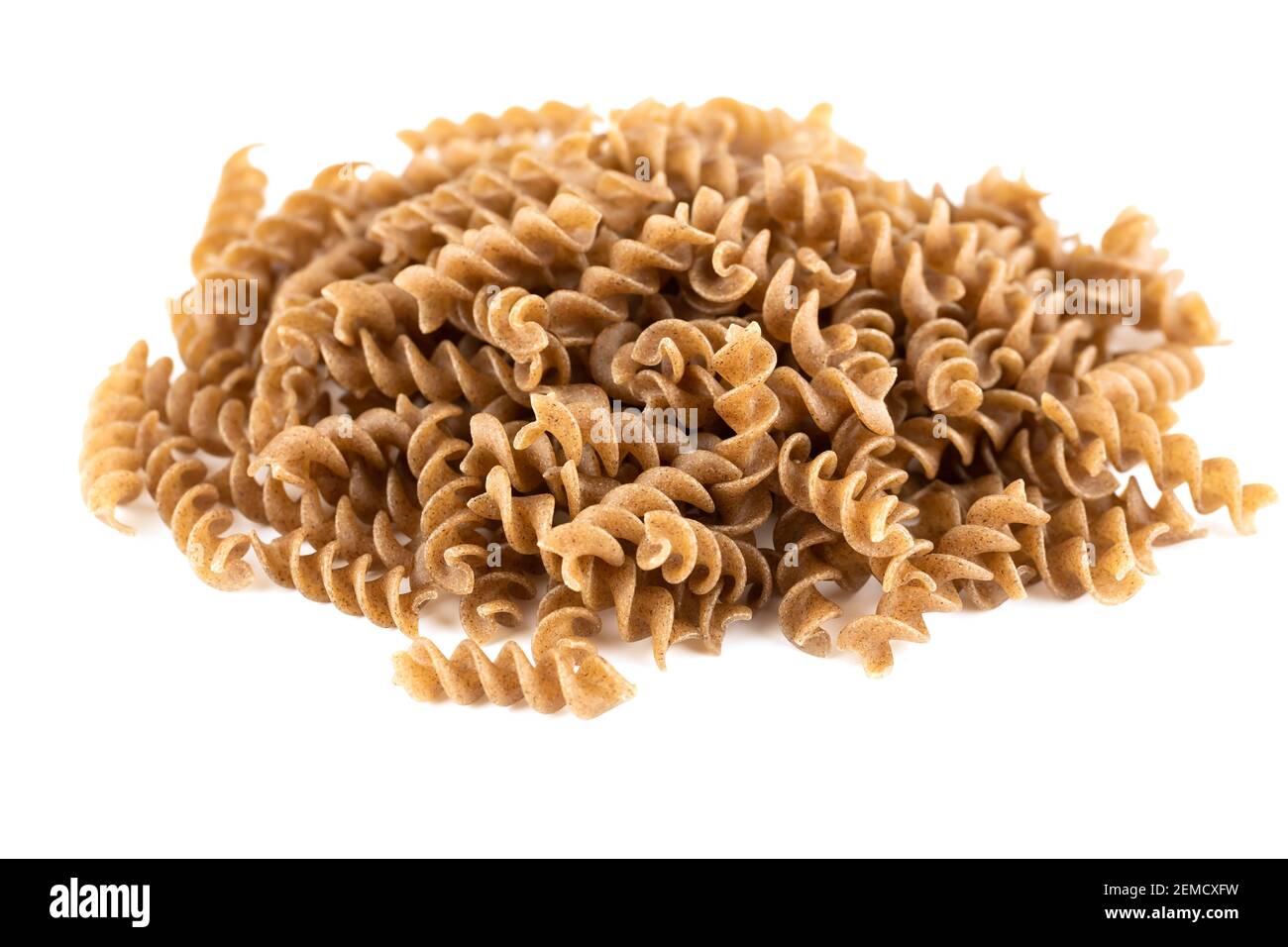 The heap of fusilli pasta isolated on white background. Stock Photo