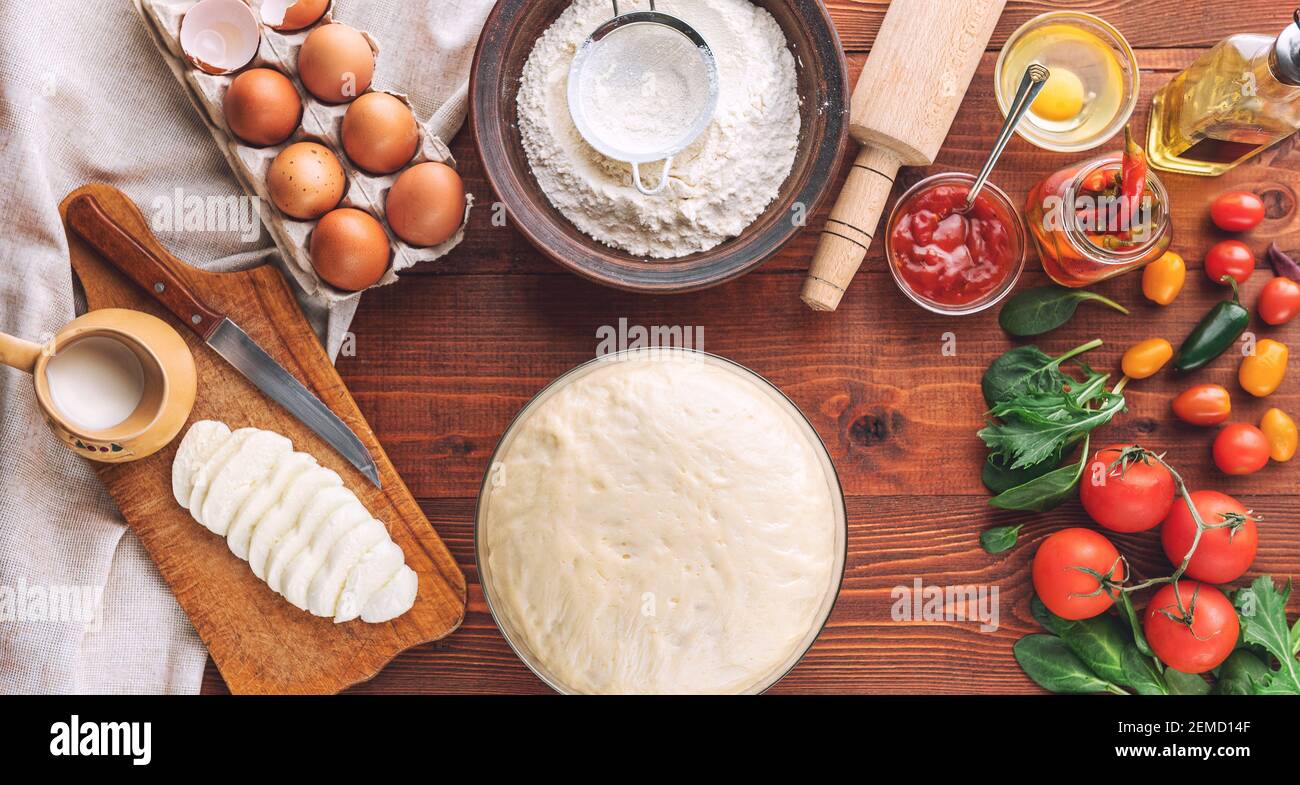 Stepbystep boss makes a pizza margarita. Dough and pizza ingredients