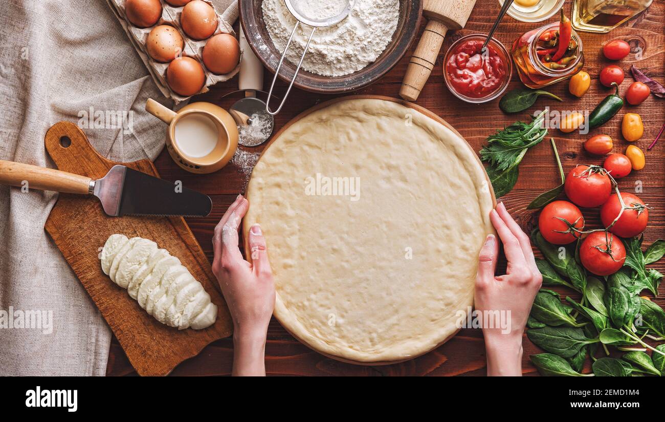 Stepbystep boss makes a pizza margarita. Dough and pizza ingredients