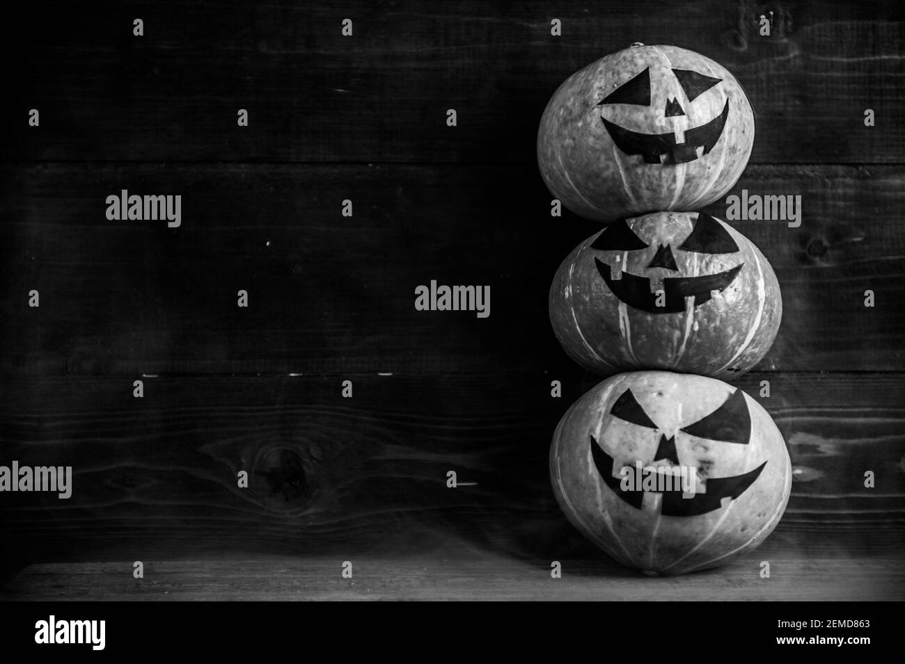 Carved halloween pumpkin background Black and White Stock Photos ...