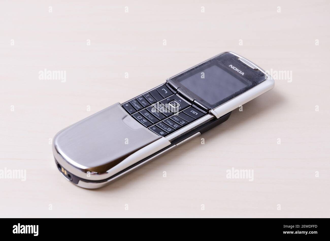 Nokia 8800 stainless-steel slider mobile or cell phone from 2005 on bright  wooden background or desk, close-up, indoors Stock Photo - Alamy