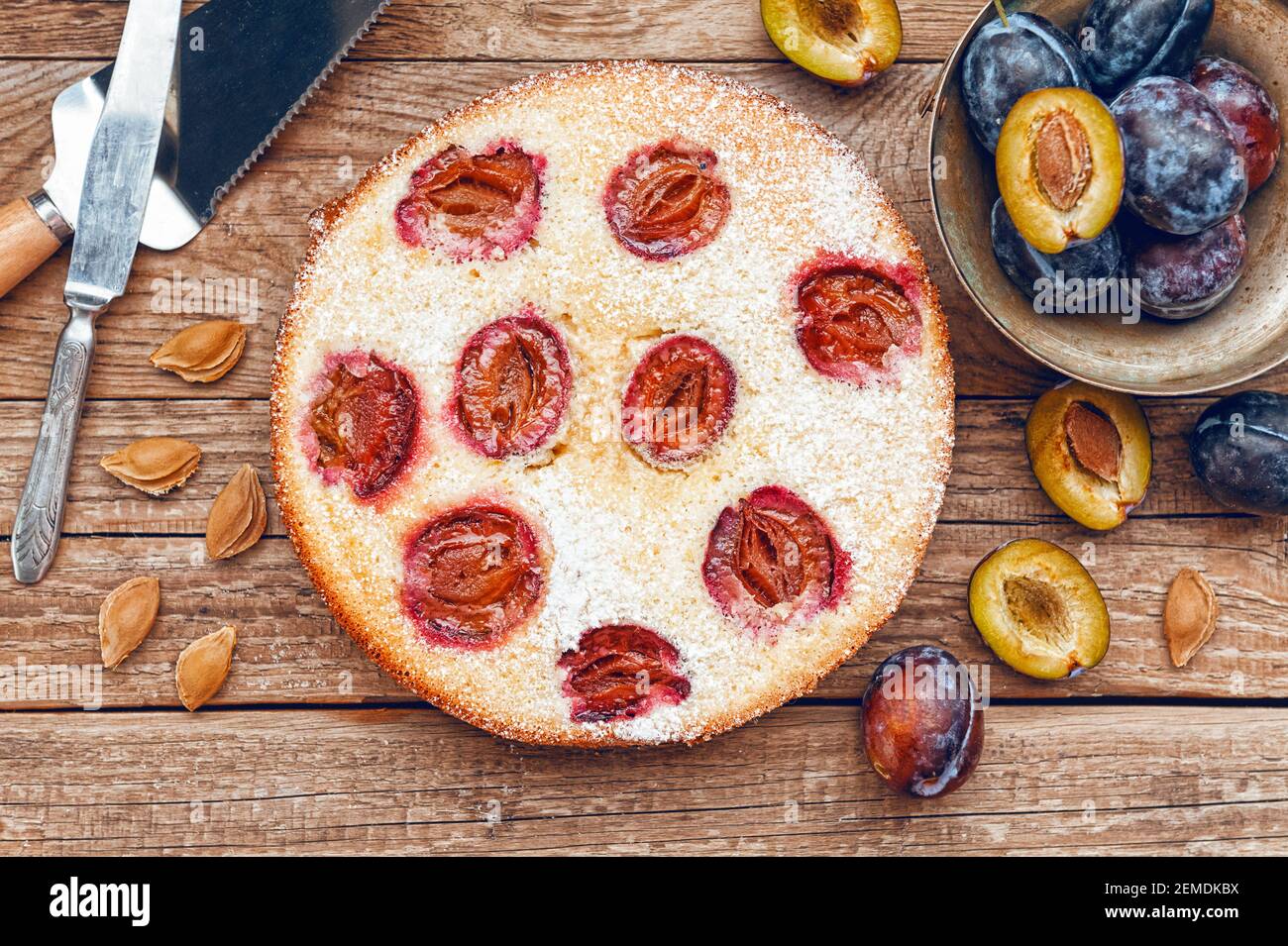 Pie with plum. In rustic style on a wooden surface Stock Photo