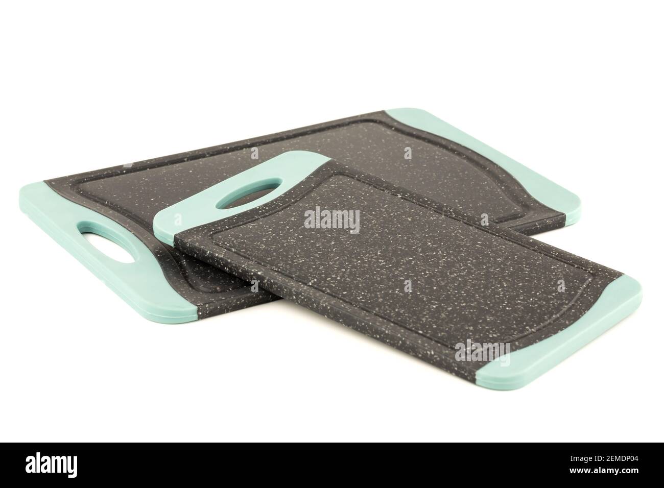 Two black plastic cutting boards isolated on white background. Stock Photo