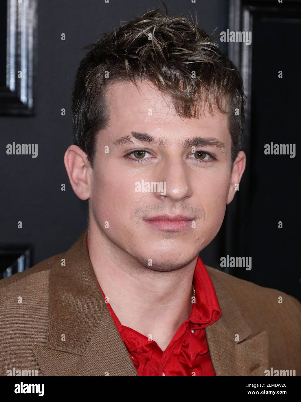 LOS ANGELES, CA, USA - FEBRUARY 10: Singer Charlie Puth wearing a Prada ...