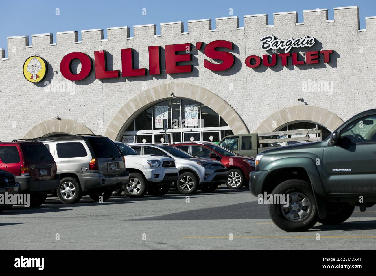 A logo sign outside of a Ollie's Bargain Outlet retail store in