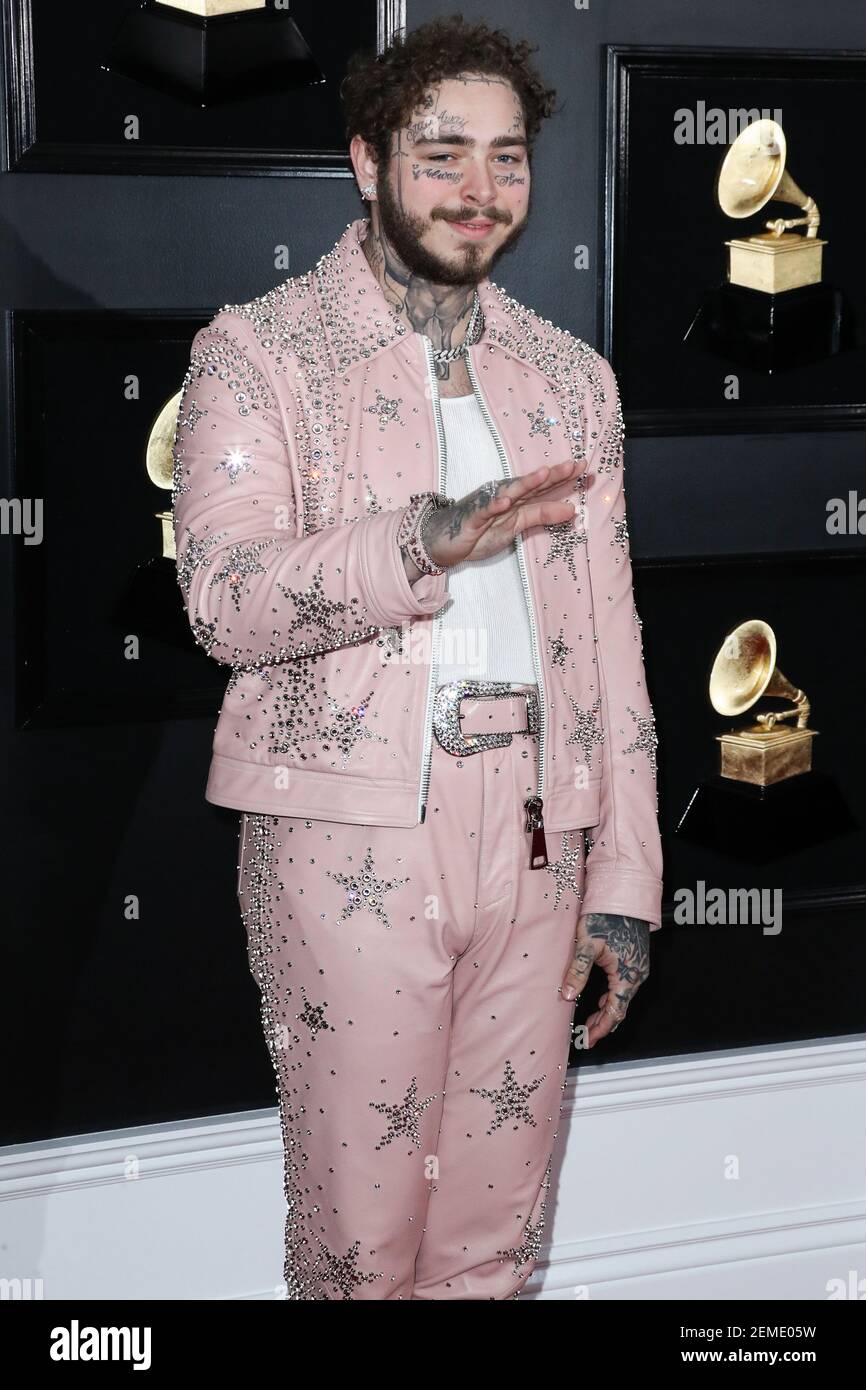 LOS ANGELES, CA, USA - FEBRUARY 10: Rapper Post Malone wearing a custom  pink Ashton Michael suit designed by Catherine Hahn, studded by Star  Studded, a Tom Ford tank, Scott Wayne boots,