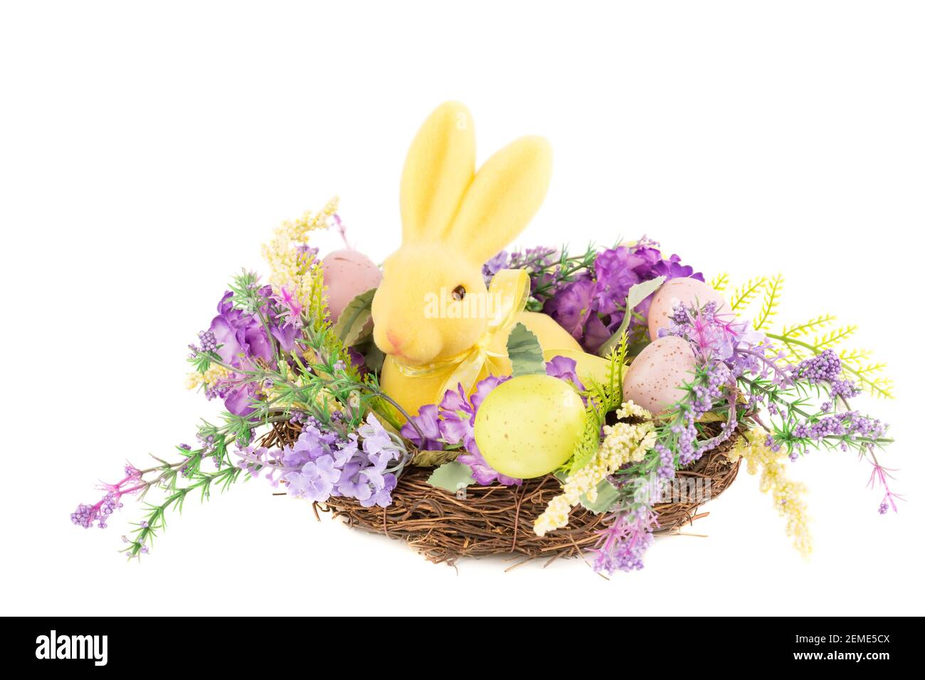 Easter colorful eggs and bunny in nest, flowers isolated on white ...
