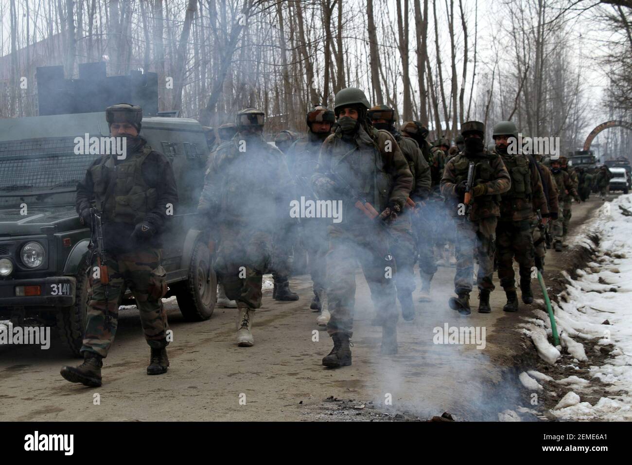 SRINAGAR, INDIA – FEBRUARY 12: Security forces near the site of encounter at the Ratnipora area of south Kashmir's Pulwama district, some 30 kilometers south of Srinagar, on February 12, 2019 in Jammu and Kashmir, India. A soldier and a militant were killed while a residential house where the militants were hiding was damaged in the fierce gunfight. (Photo by Waseem Andrabi/ Hindustan Times/Sipa USA) Stock Photo