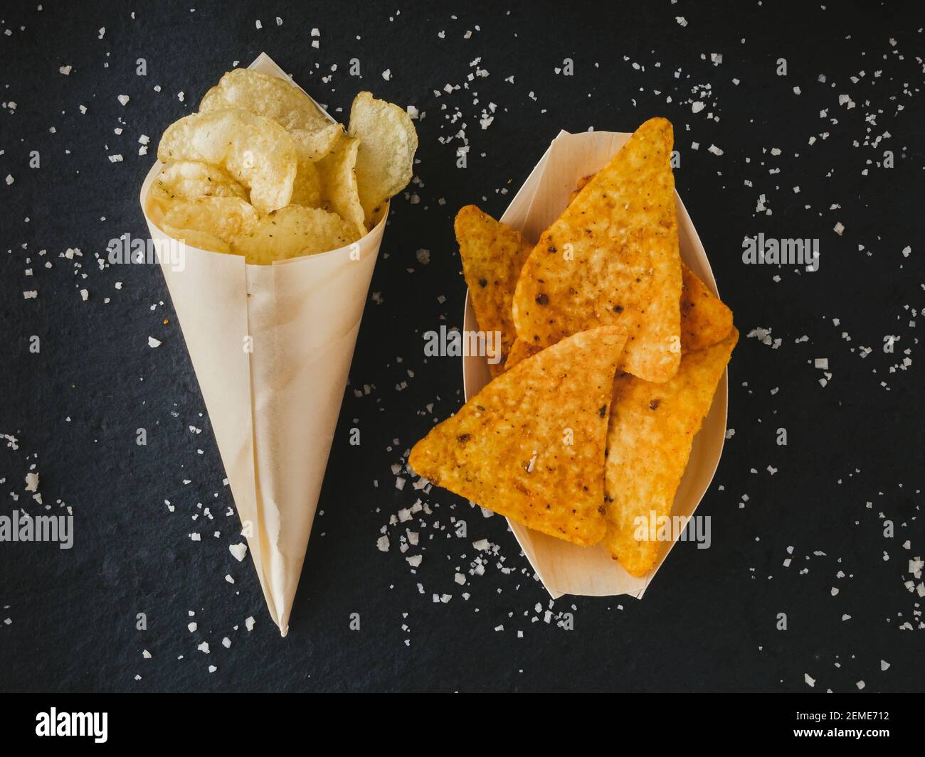 food background. Chips for appetizer. Yellow triangle shaped tortilla