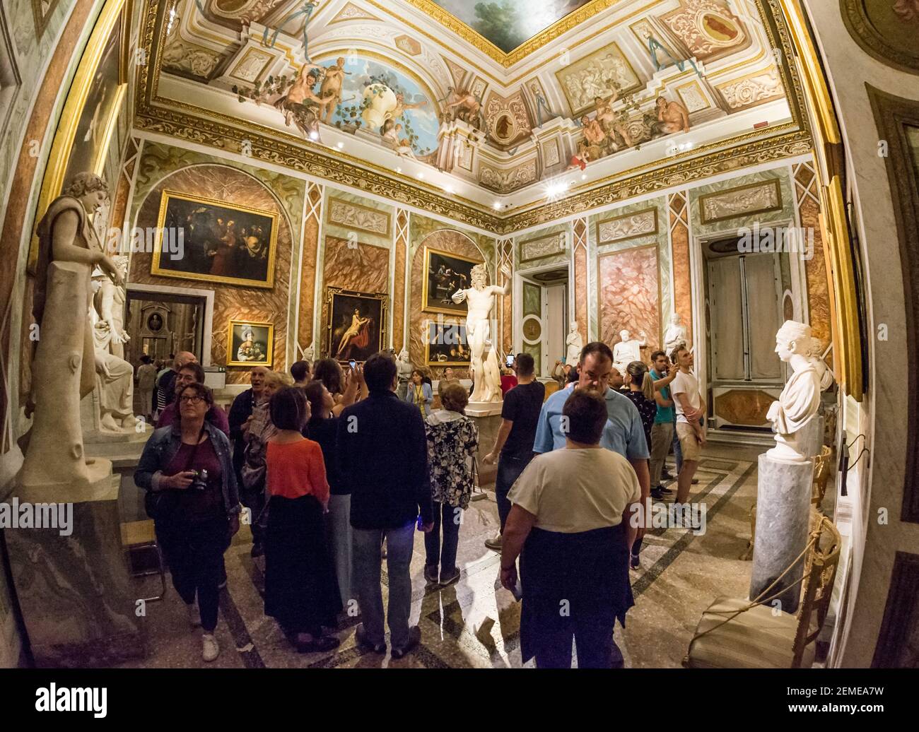 Rome, Italy - Oct 05, 2018: Tourists admire the sculpture of Dancing satyr in the Borghese Gallery, Rome Stock Photo
