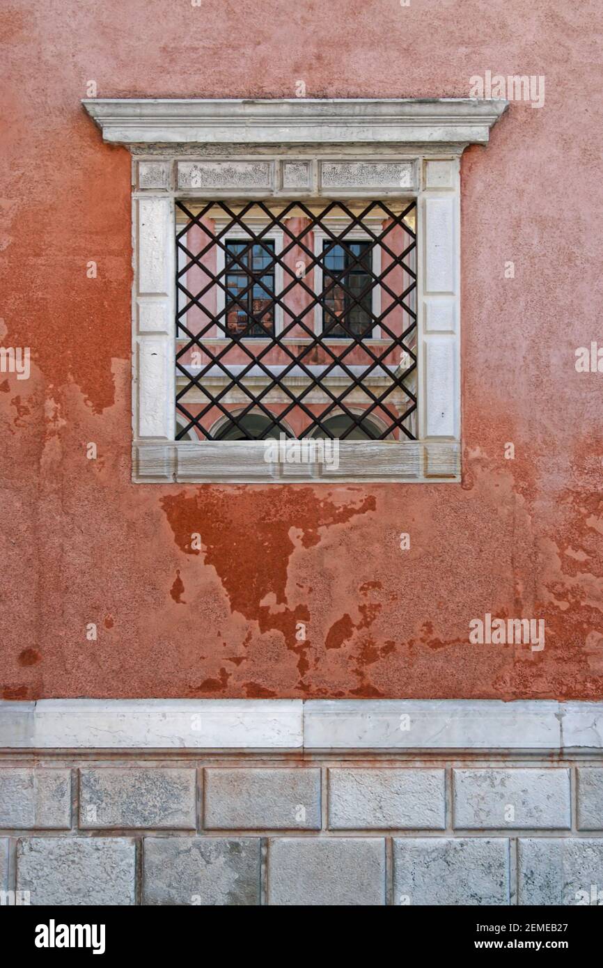 Architectural photography about a authentic mediterranean italian house: another window appears in the window on the wall; color photo. Stock Photo