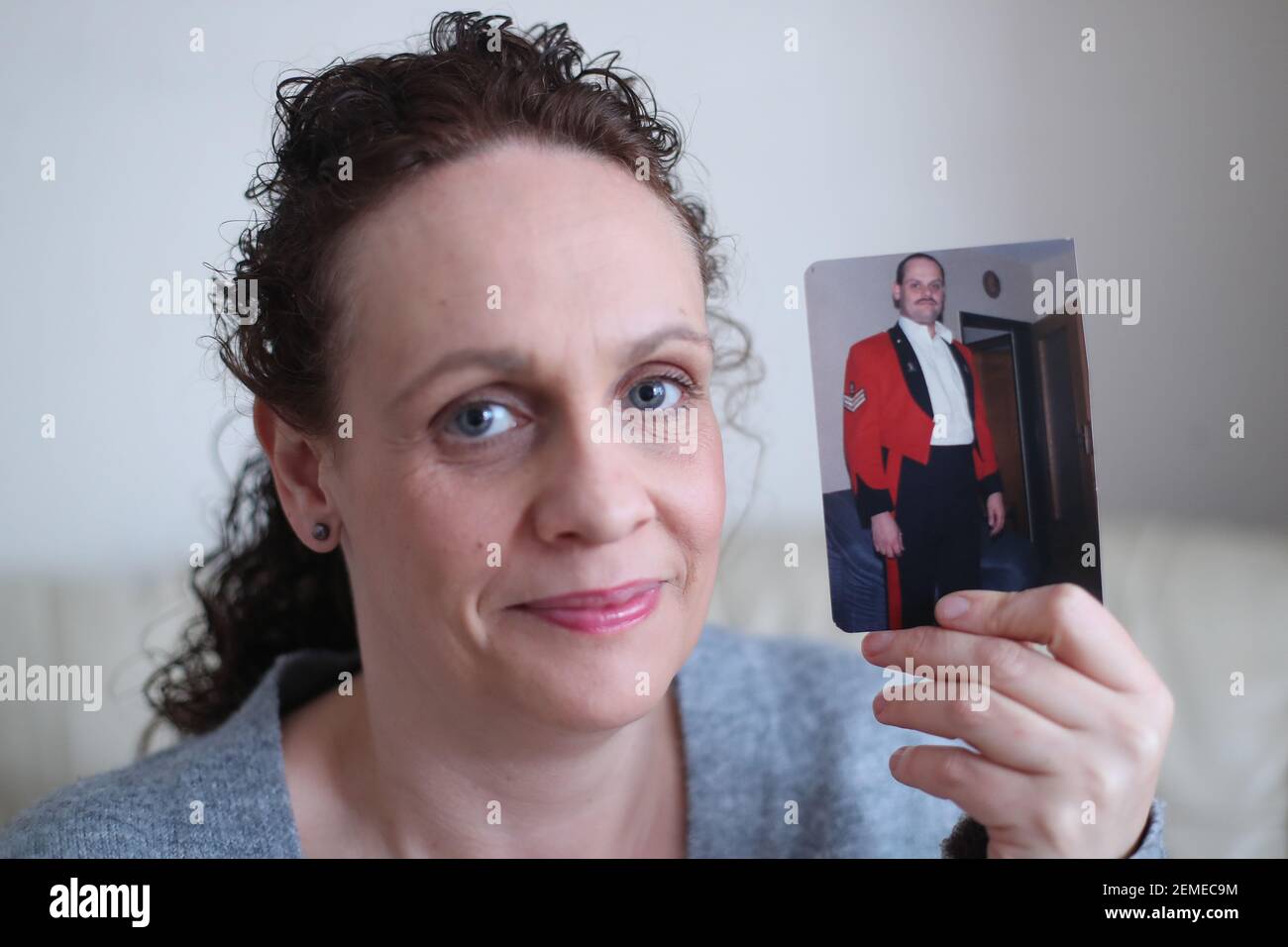 Michelle Rogers with a picture of her dad Staff Sergeant Keith Rogers who served two tours in the Gulf in 1990-91. Michelle, whose father died at the age of 59, wants recognition in the UK for 'Gulf War syndrome'. The syndrome is recognised in the United States but not in the UK. Picture date: Wednesday February 24, 2021. Stock Photo