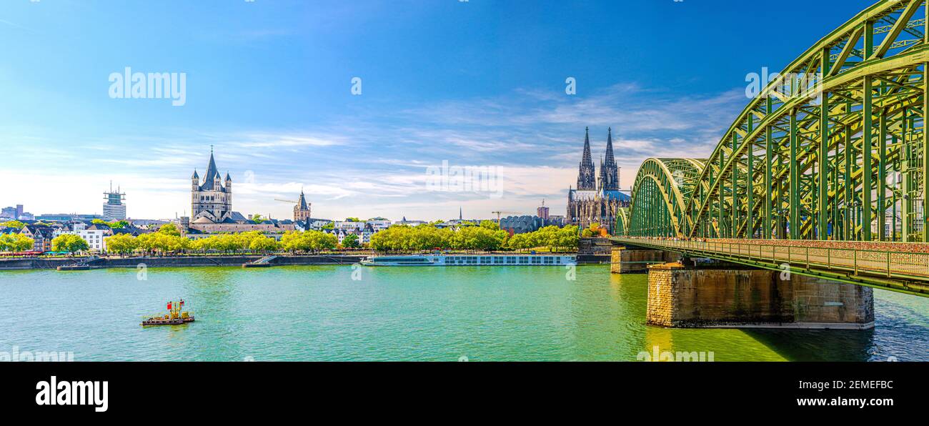 Panorama of Cologne city historical centre with Cologne Cathedral of Saint Peter, Great Saint Martin Roman Catholic Church buildings and Hohenzollern Stock Photo