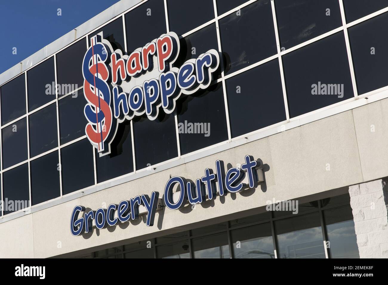 A logo sign outside of a Sharp Shopper Grocery Outlet store location in