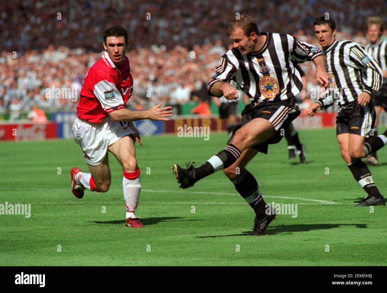 Newcastle's Alan Shearer May 1998shoots the ball past Martin Keown of Arsenal in the FA Cup Final Arsenal v Newcastle United Stock Photo