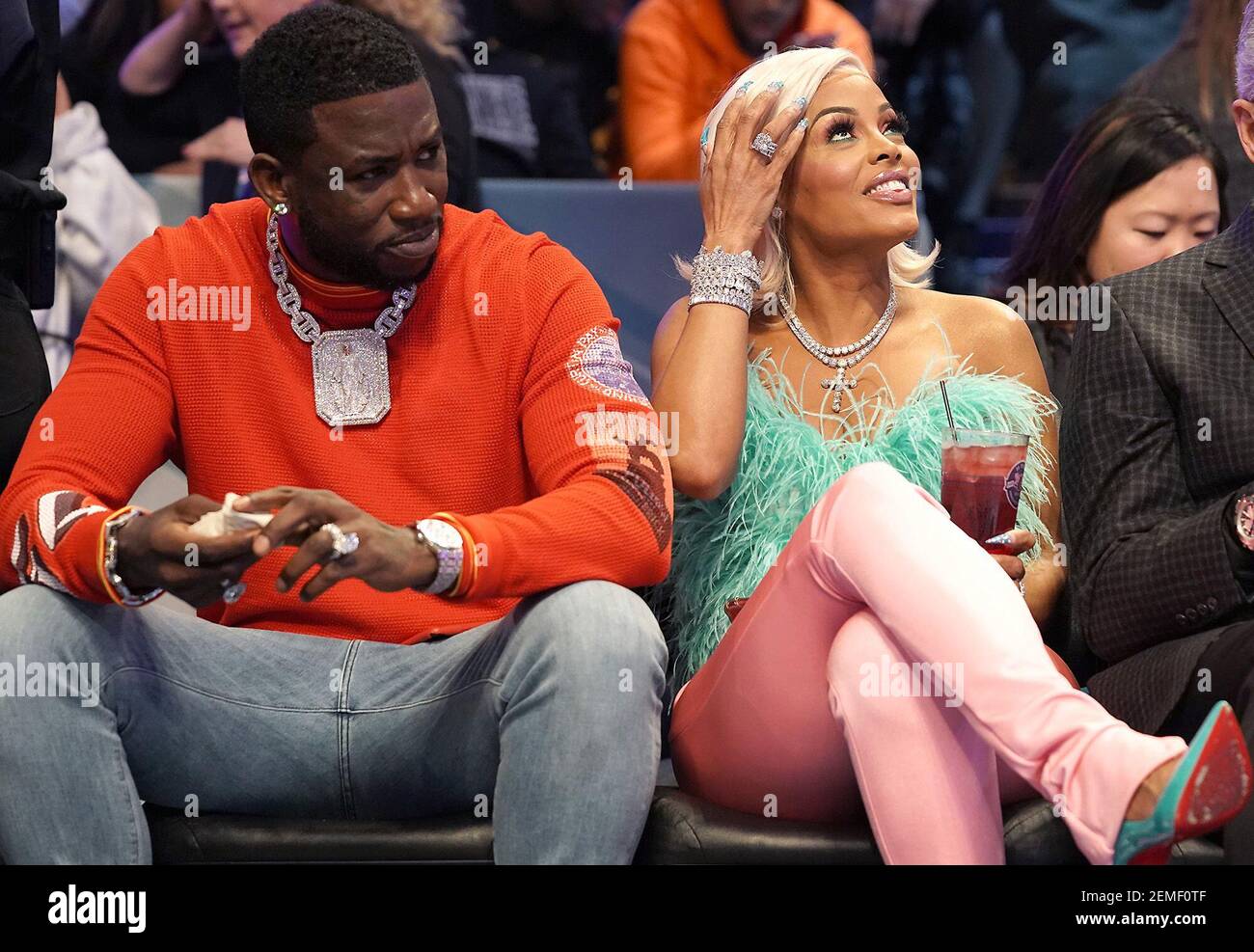 Rapper Gucci Mane, left, and his wife, Keyshia Ka'Oir, sit courtside during  the NBA All-Star Saturday Night festivities at Spectrum Center in  Charlotte, N.C., on Saturday, Feb. 16, 2019. (Photo by Jeff