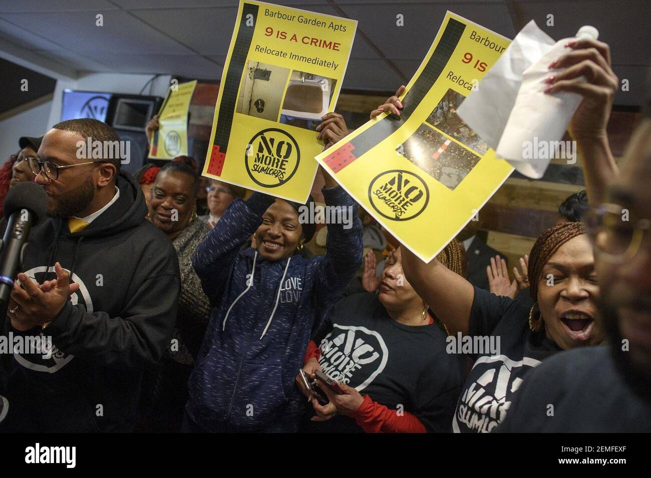 The Rev. A.J. Johnson, left, and residents of Barbour Gardens chant 'No more slum lords,' while meeting with the press on Feb. 14, 2019 to highlight HUD's announcement that the residents are to be relocated. (Photo by Mark Mirko/Hartford Courant/TNS/Sipa USA) Stock Photo