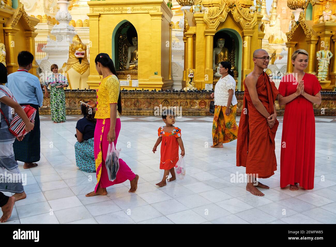 Visitors and tourists at Shwedagon Pagoda temple complex in Yangon, Myanmar. Stock Photo