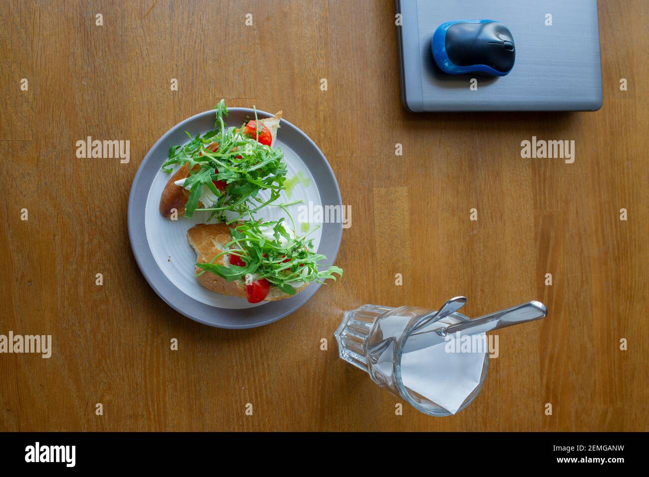 Healthy sandwich on office table. Laptop on the table and a sandwich ...