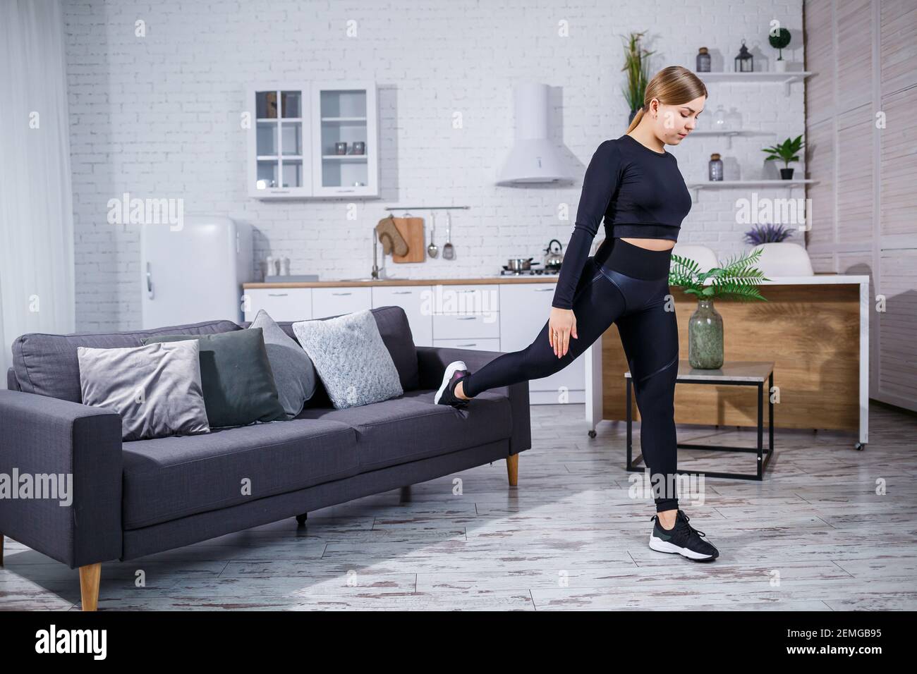 Young beautiful sports girl in leggings 