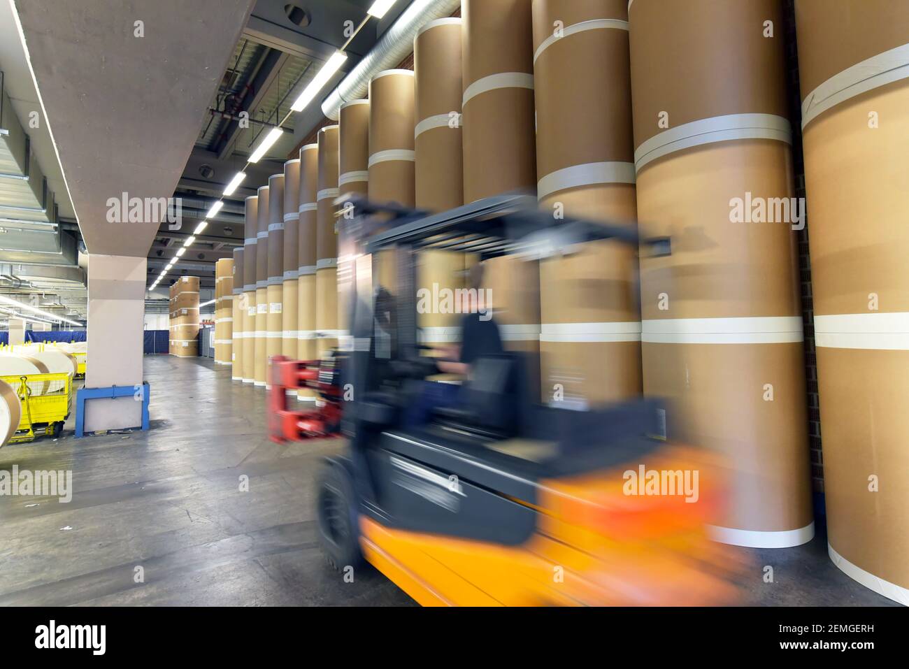 Storage of paper rolls in a large print shop - transport with a forklift truck Stock Photo