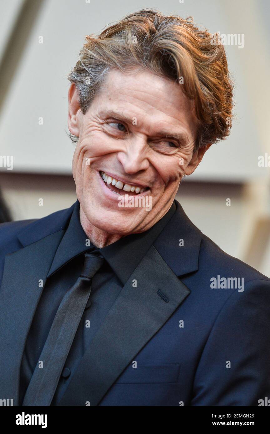 Willem Dafoe walking on the 2019 Oscars red carpet at the 91st Academy