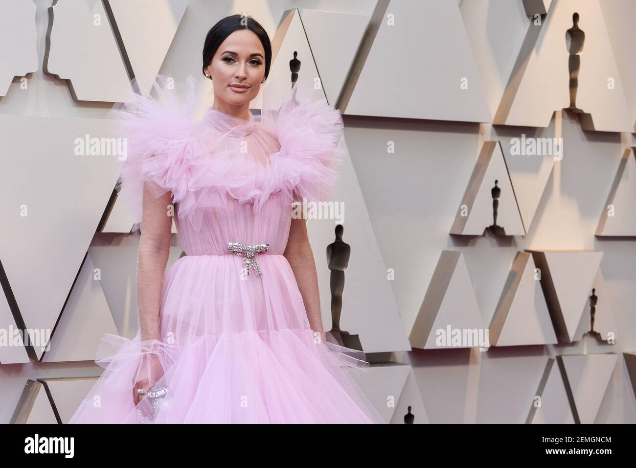 Kacey Musgraves walking on the 2019 Oscars red carpet at the 91st