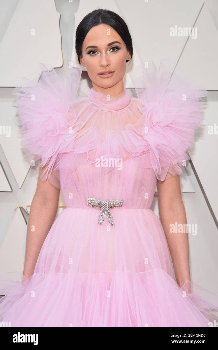 Kacey Musgraves walking on the 2019 Oscars red carpet at the 91st