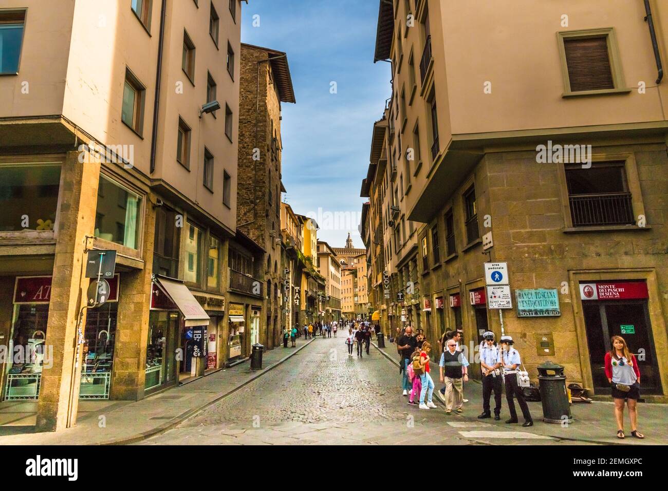 Nice street view of Via Por Santa Maria near the bridge Ponte Vecchio of the historic city centre of Florence, Italy. People are walking on the... Stock Photo
