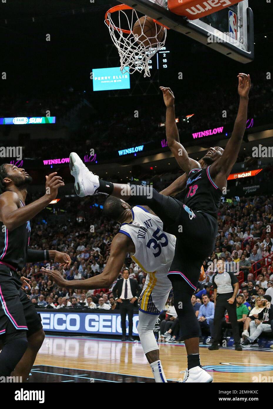 Miami Heat forward Bam Adebayo (13) dunks over Golden State Warriors  forward Kevin Durant (35) in the second quarter at AmericanAirlines Arena  in Miami on Wednesday, Feb. 27, 2019. The Heat won,