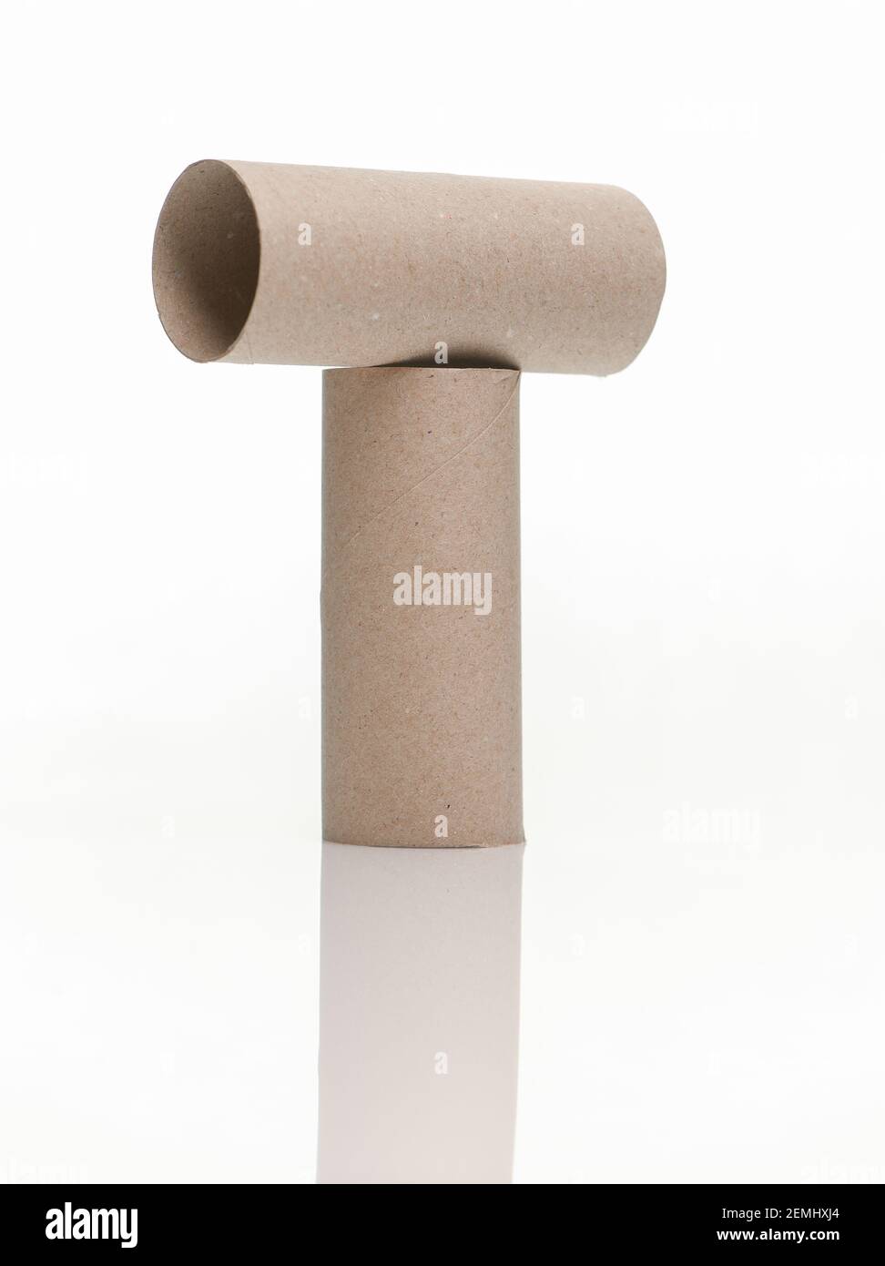 Cardboard toilet rolls inner tubes on white background with a