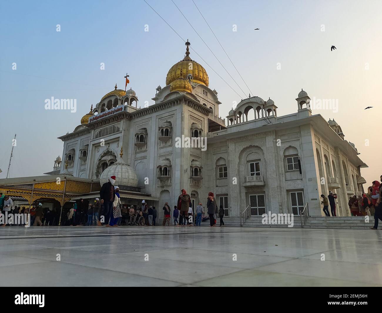 Gurdwara Bangla Sahib is the most prominent Sikh Gurudwara, Bangla Sahib Gurudwara in New Delhi, India inside view during evening time Stock Photo