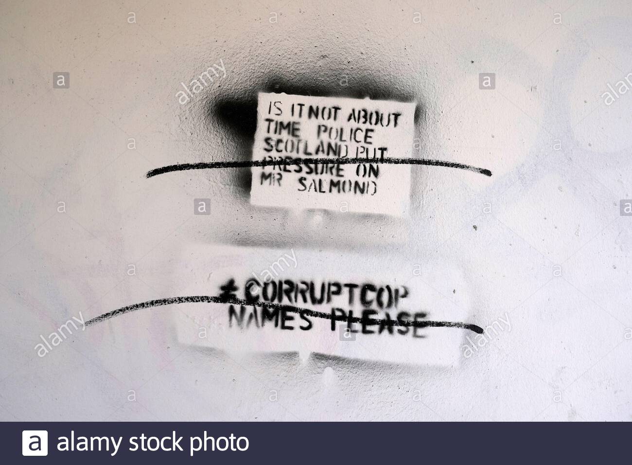 Edinburgh, Scotland, UK. 25th Feb 2021. Graffiti on a city centre wall regarding the Holyrood Inquiry into Alex Salmond who will give evidence to the Scottish parliamentary committee on Friday and are looking into the government mishandling of the complaints against him.  Credit: Craig Brown/Alamy Live News Stock Photo
