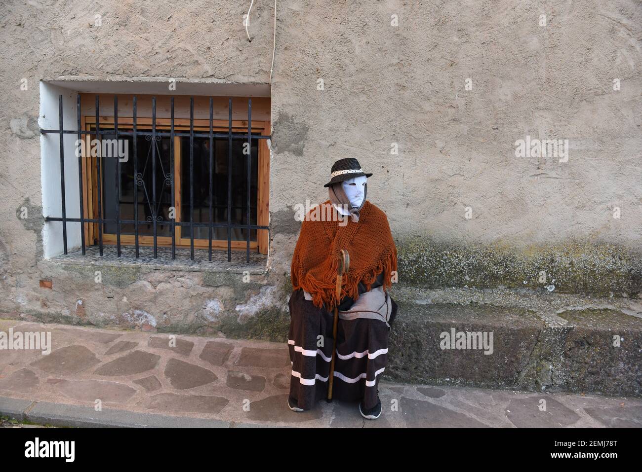 A Reveller Wearing A Masks And A Costume Is Seen During A Traditional a-reveller-wearing-a-masks-and-a-costume-is-seen-during-a-traditional