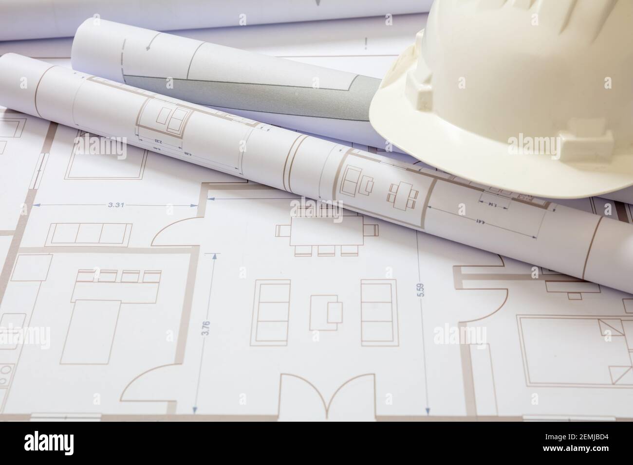 Real estate, housing project construction concept. Project blueprints and engineer hardhat white color on drawings background, copy space Stock Photo