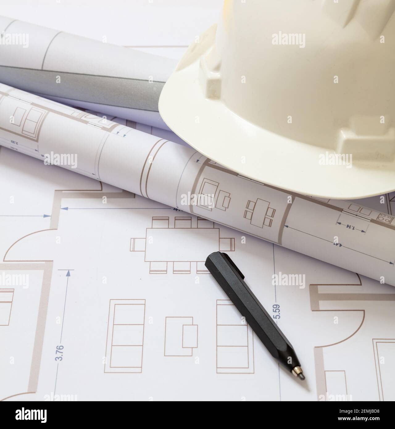 Real estate, housing project construction concept. Project blueprints and engineer hardhat white color on drawings background, copy space Stock Photo