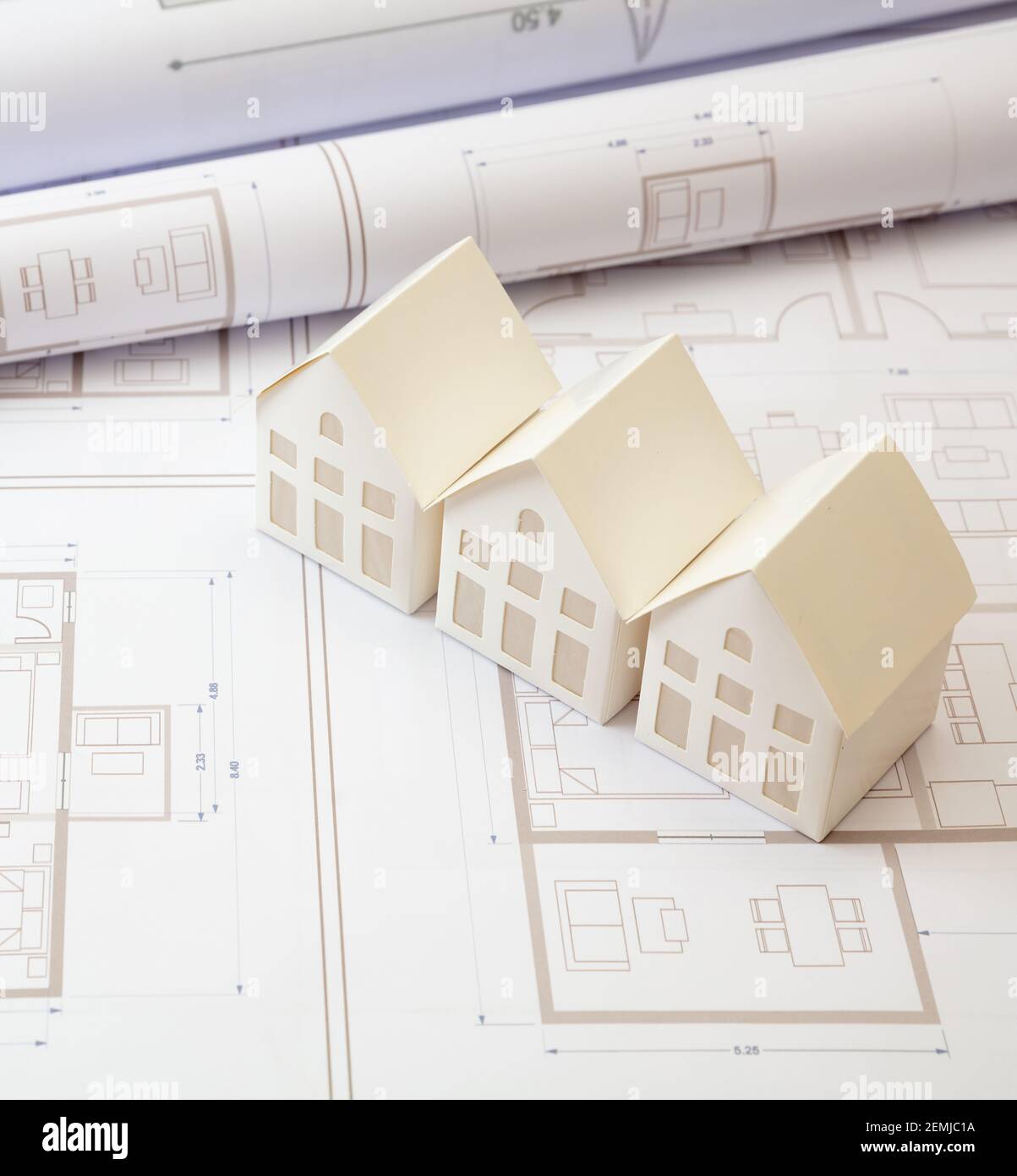 Real estate, construction blueprints concept. Residence complex architectural drawings and detached houses models on an office desk. Architect enginee Stock Photo